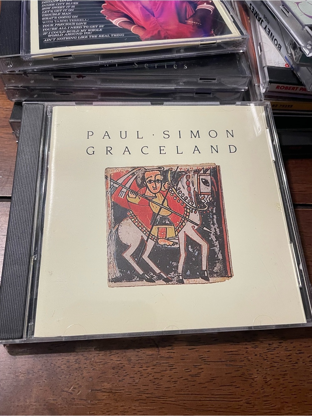 Grace Paul Simon Graceland CD — Cream, Black, Red